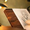 Desk Extension - drawing surface close-up under lamp