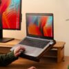 Laptop Holder - person using laptop on holder at desk