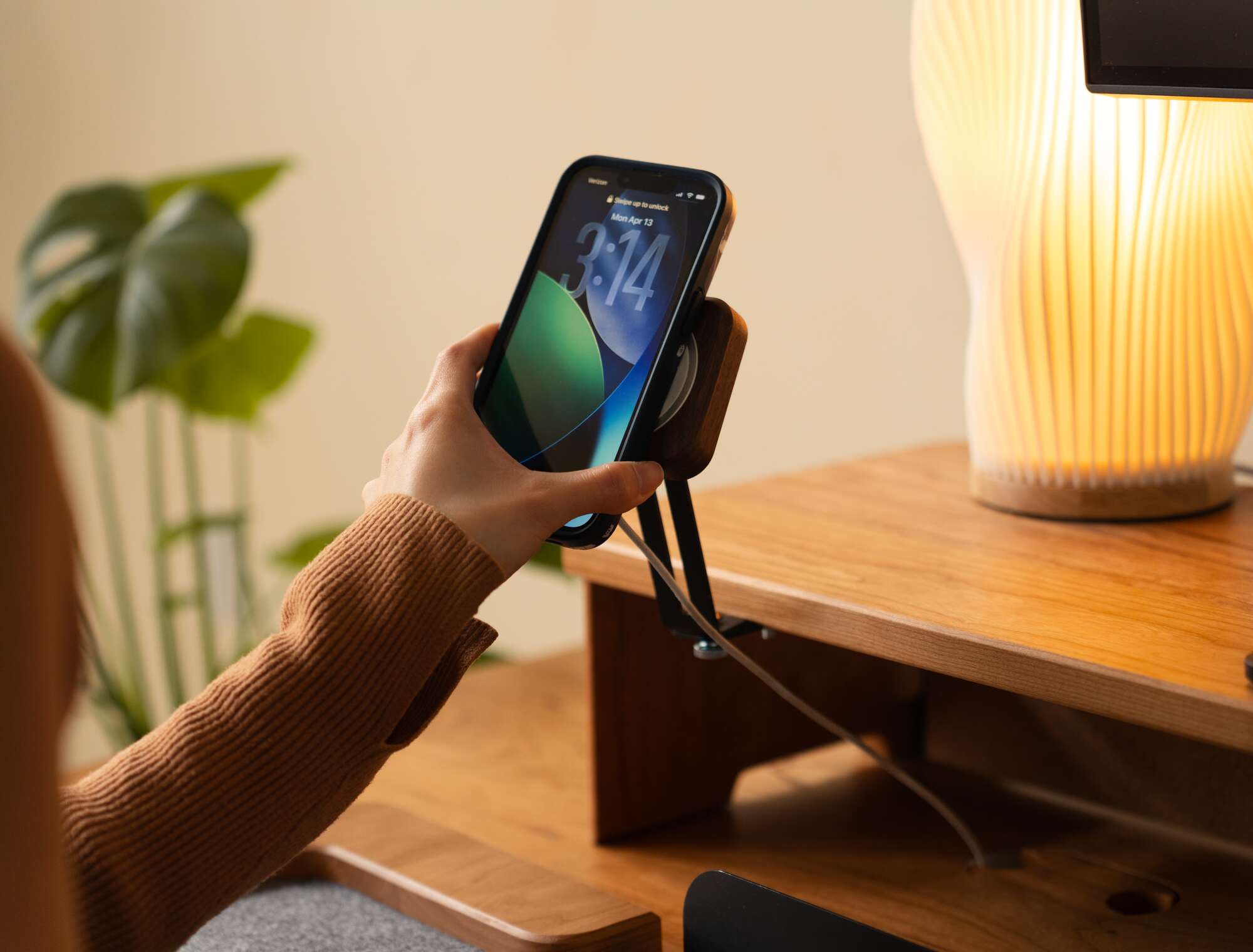 MagSafe Charger - hand placing phone on charger stand